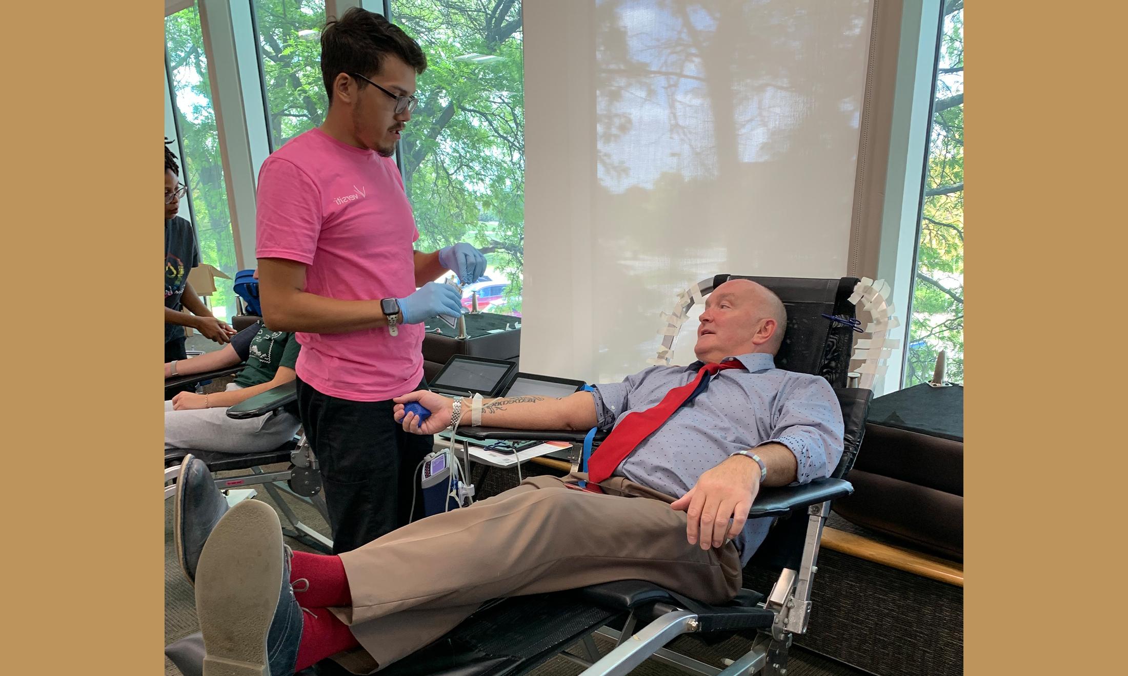 An image of Doug Gould donating blood